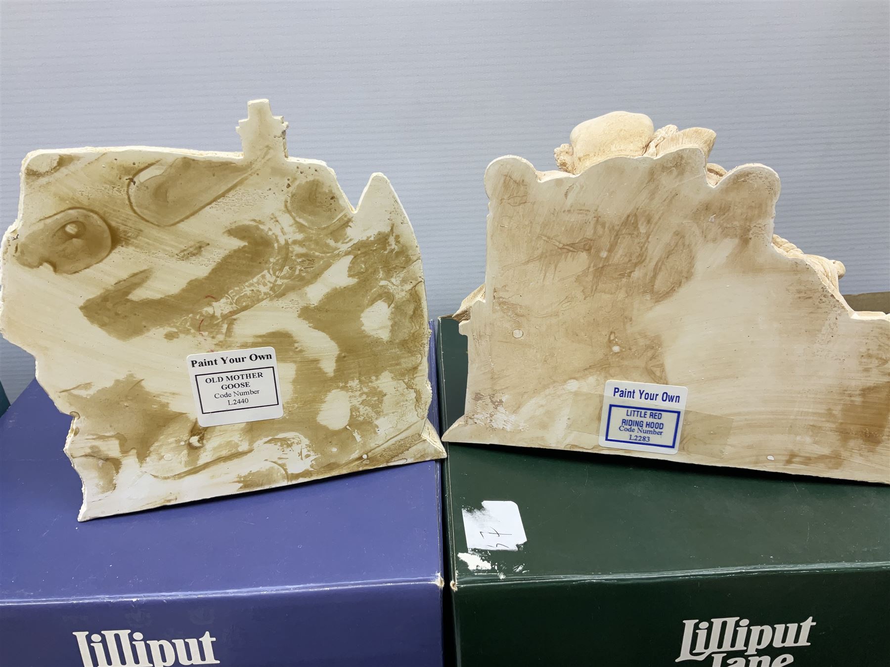 Ten Lilliput Lane models from the 'Paint Your Own' collection, to include cottages and plaques, all boxed, to include one boxed model with paints and brushes and a further box of paints