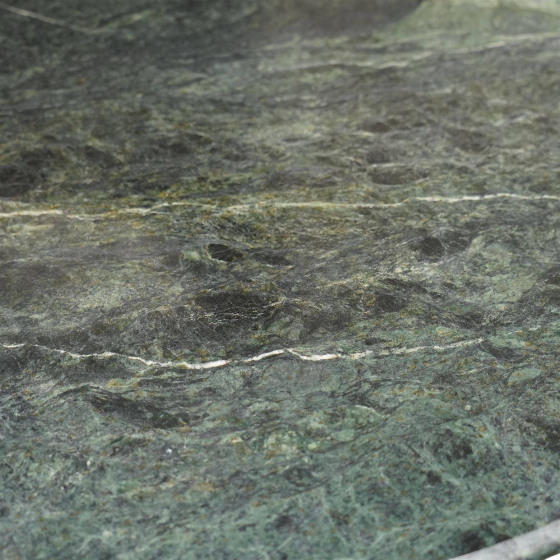 Contemporary circular green marble bistro table, raised on a black metal tubular base with decorative slatted collar, with two coordinating metal and wood slatted chairs