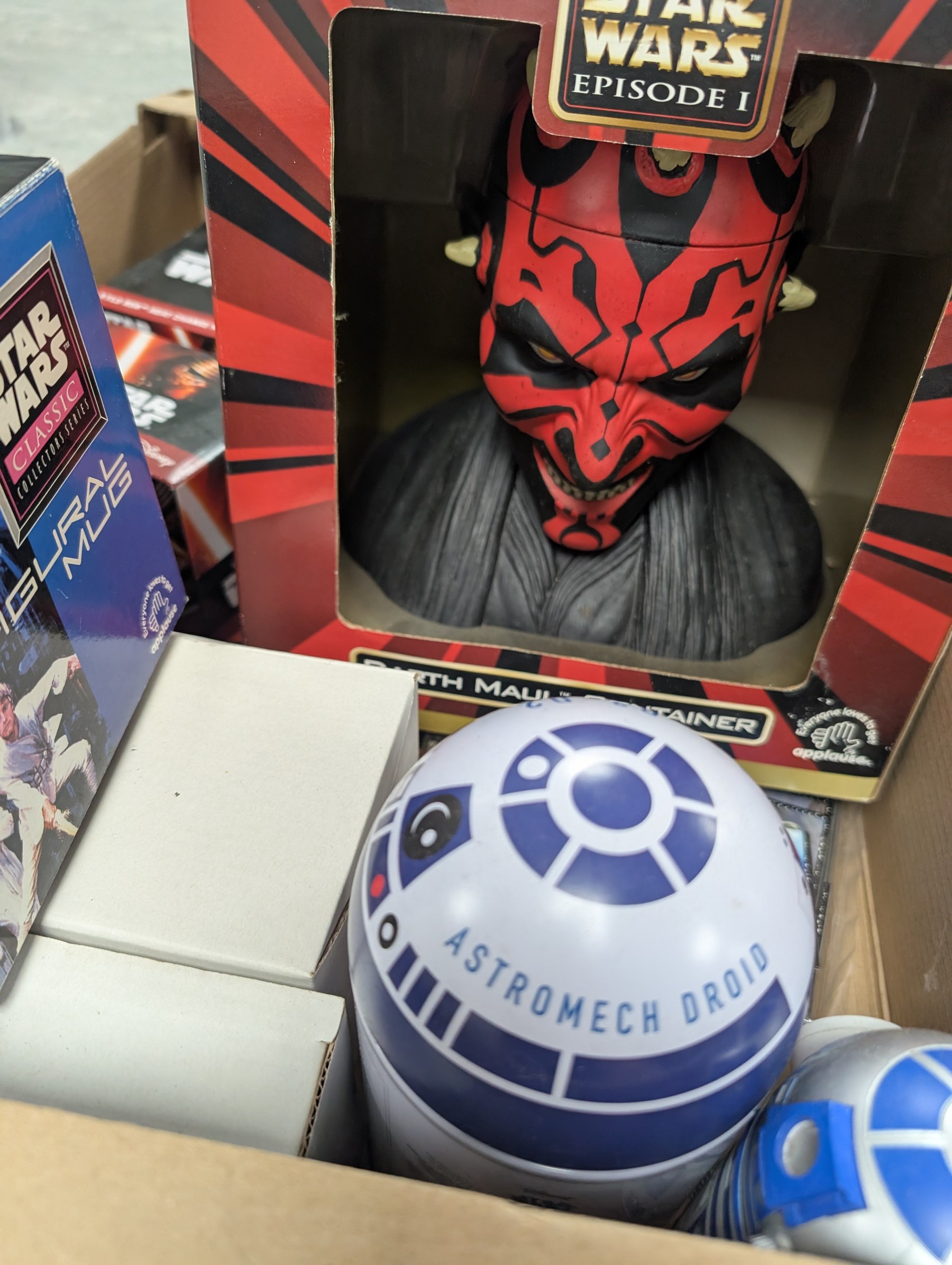 Large collection of Star Wars collectables, including figural mugs, books, talking bank, Darth Maul container, glasses, etc, in five boxes