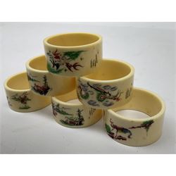 Set of six early 20th century Chinese ivory napkin rings decorated with figural scenes and calligraphy