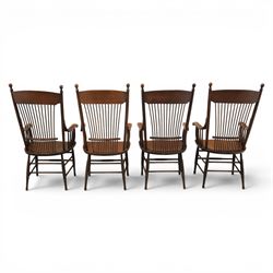 Set of eight 19th century ash and elm spindle back Windsor armchairs, arched top rails above fan-shaped spindle backs, curved arms with turned supports, shaped saddle seats, on turned legs joined by H-stretchers