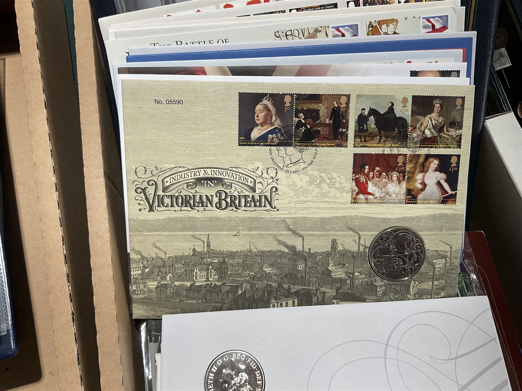 Approximately one hundred and fifteen Royal Mint coin covers, in two ring binder folders and loose, together with approximately 53 grams of Great British pre-1920 and approximately 68 grams of Great British pre-1947 silver threepence coins, and a small quantity of further pre-decimal coins