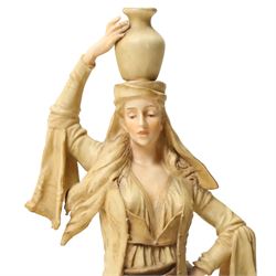 Pair of Ernst Wahliss for Turn Wien porcelain figures of Middle Eastern water carriers, taller figure H35cm