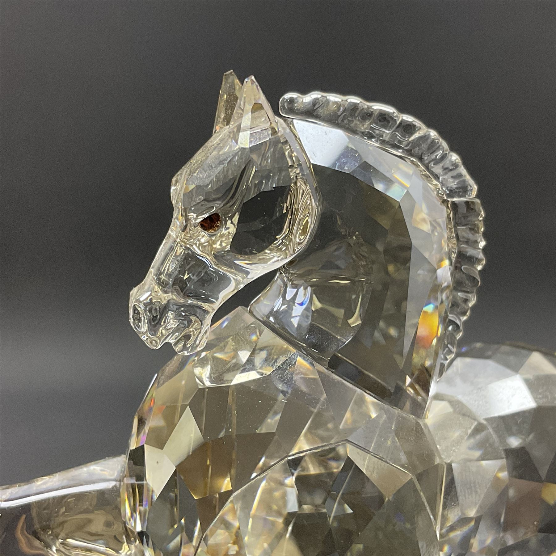 Two Swarovski Crystal Signs of the Zodiac figures, comprising horse and tiger, together with Zodiac dragon holding the flaming pearl, largest H11cm 