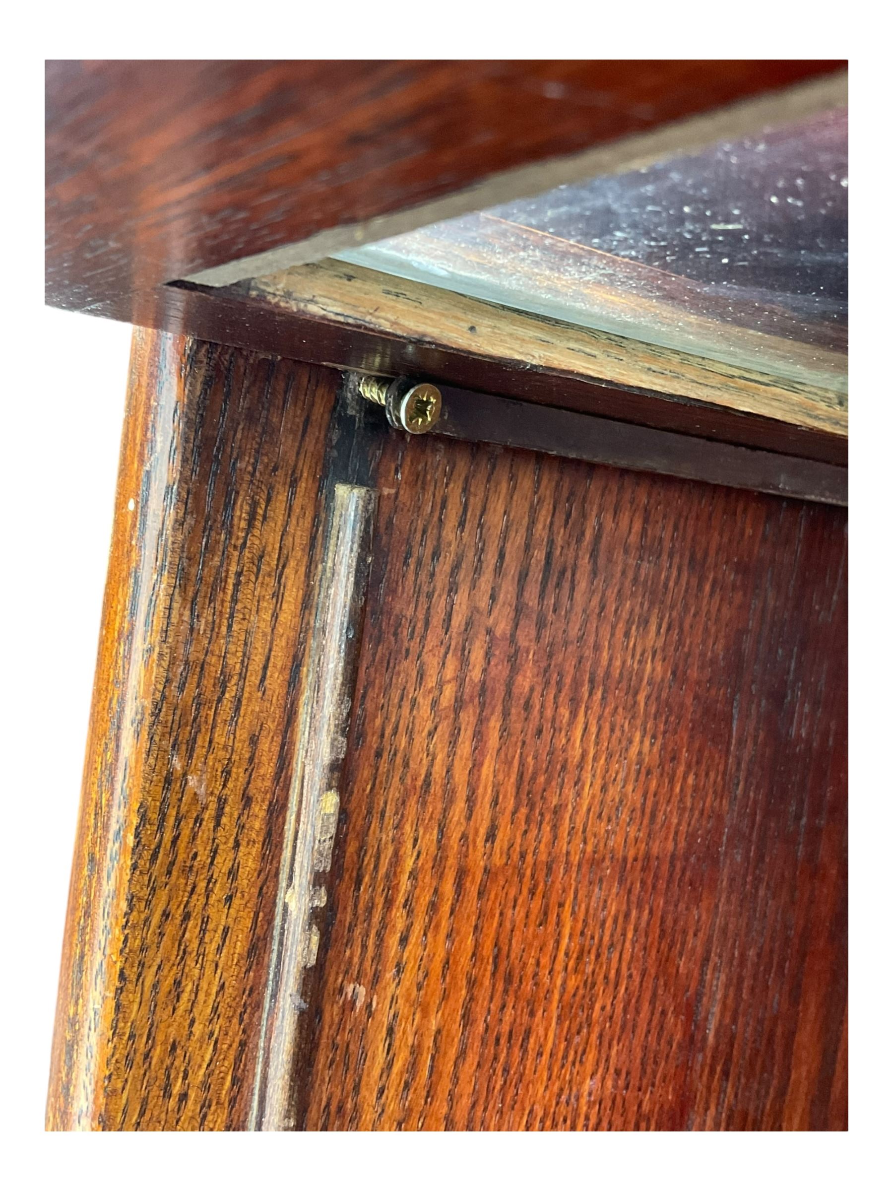 Early 20th century oak stacking library bookcase, four sections enclosed by hinged and sliding glazed doors, fitted with single drawer 