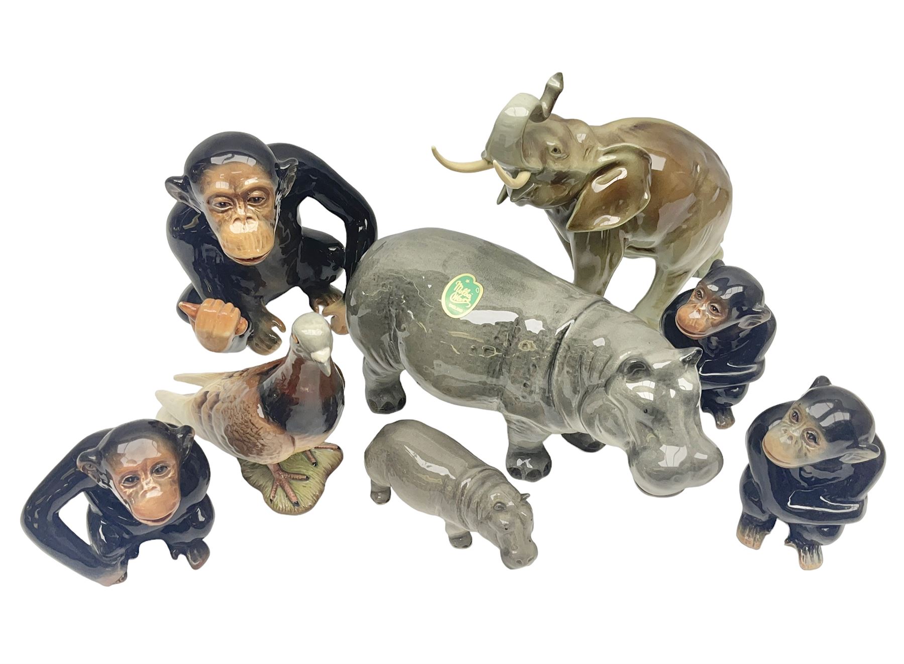 Large Sylvac monkey together with three smaller monkeys, together with Beswick Pigeon no 1383, Melba Ware hippo and baby and Royal Dux elephant 