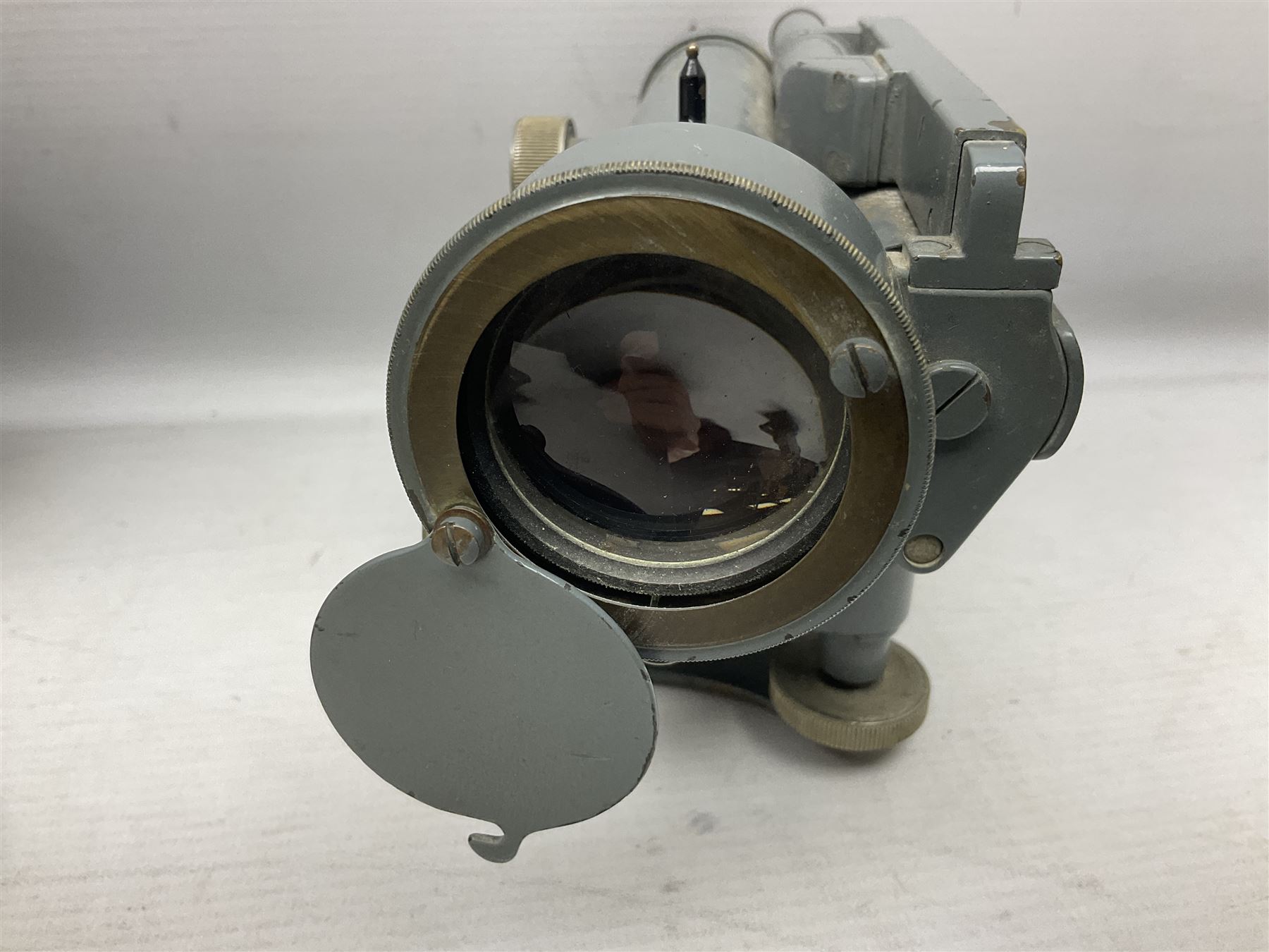 Cooke Troughton & Simms grey painted brass dumpy level in carrying case; and WW2 British .303 Vickers Machine Gun brass Clinometer, stamped 'V.E. 0067' serial No. 2370,  dated 1944 unboxed (2)
