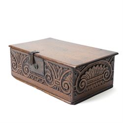 18th century oak desk box with plain hinged lid, the sides and front carved with stylised leaves and scrolls 40cm x 24cm x 14cm