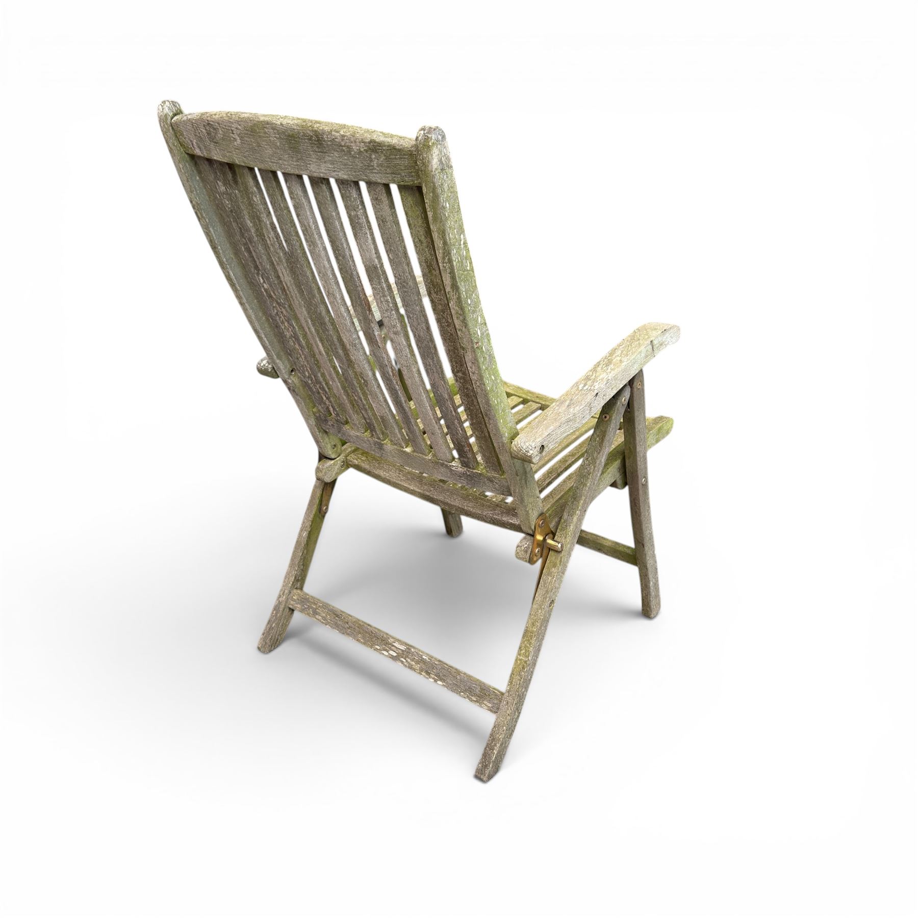 Five piece teak garden dining set, comprising circular folding table and four folding armchairs, with slatted seats and backs in a weathered finish