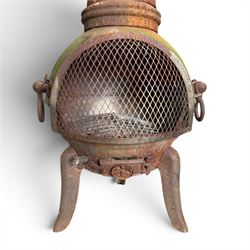 Garden chiminea, with mesh front spark guard, flue chimney on three splayed legs, in a weathered finish