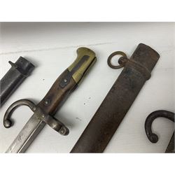 French Model 1874 Epee bayonet marked Oulle 1876 in associated scabbard; Model 1866 sabre bayonet in cut-down sword scabbard; and Model 1842/59 sabre bayonet in relic condition (3)