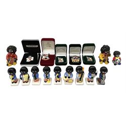 Eight ceramic Golly Band figurines marked Carlton Ware, together with four other Golly figures and five boxed badges