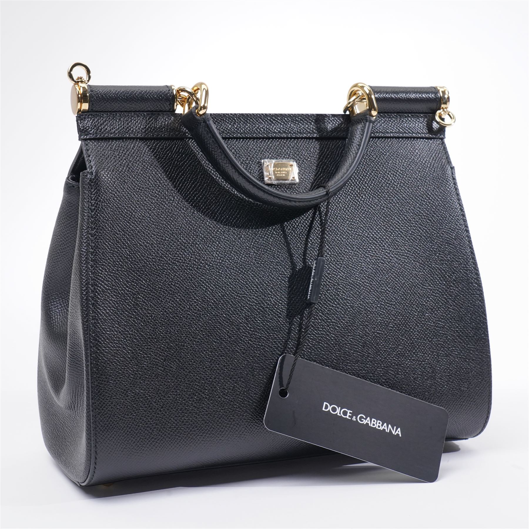 Dolce & Gabbana - 'Sicily Clock’ Medium Bag, from the Fairytale collection (Autumn/Winter 2016), in structured black textured leather, the front elaborately applied with a jewelled clock-face motif and floral embellishments, with top handle and detachable shoulder or crossbody strap, a limited production piece, unused with original box and dust bag