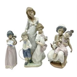 Three Lladro figures, comprising Sunday Best no 5758, Soft Meow no 5995 and Baby Doll no 5608, all with original boxes, largest example H31cm