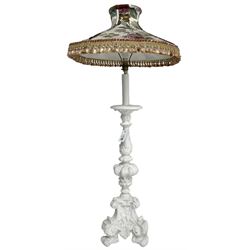 White painted Italian Baroque design standard lamp, ornately cast with foliage and scrolls, on three scrolled feet, with floral shade