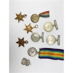 WWI British War medal awarded to 1261 Dvr. T. Paylor R.A., six WWII medals including three stars, WWII souvenir matchbox sleeve, hallmarked silver ARP badge, and an album of photographs and postcards of WWII interest, including Hitler, Montgomery, Churchill, action shots, aircraft, etc. 