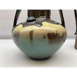 T. Forester Phoenix ware ewer of tapering form decorated with peacock and Bretby twin handled vase decorated with figures fishing in a boat sea scene