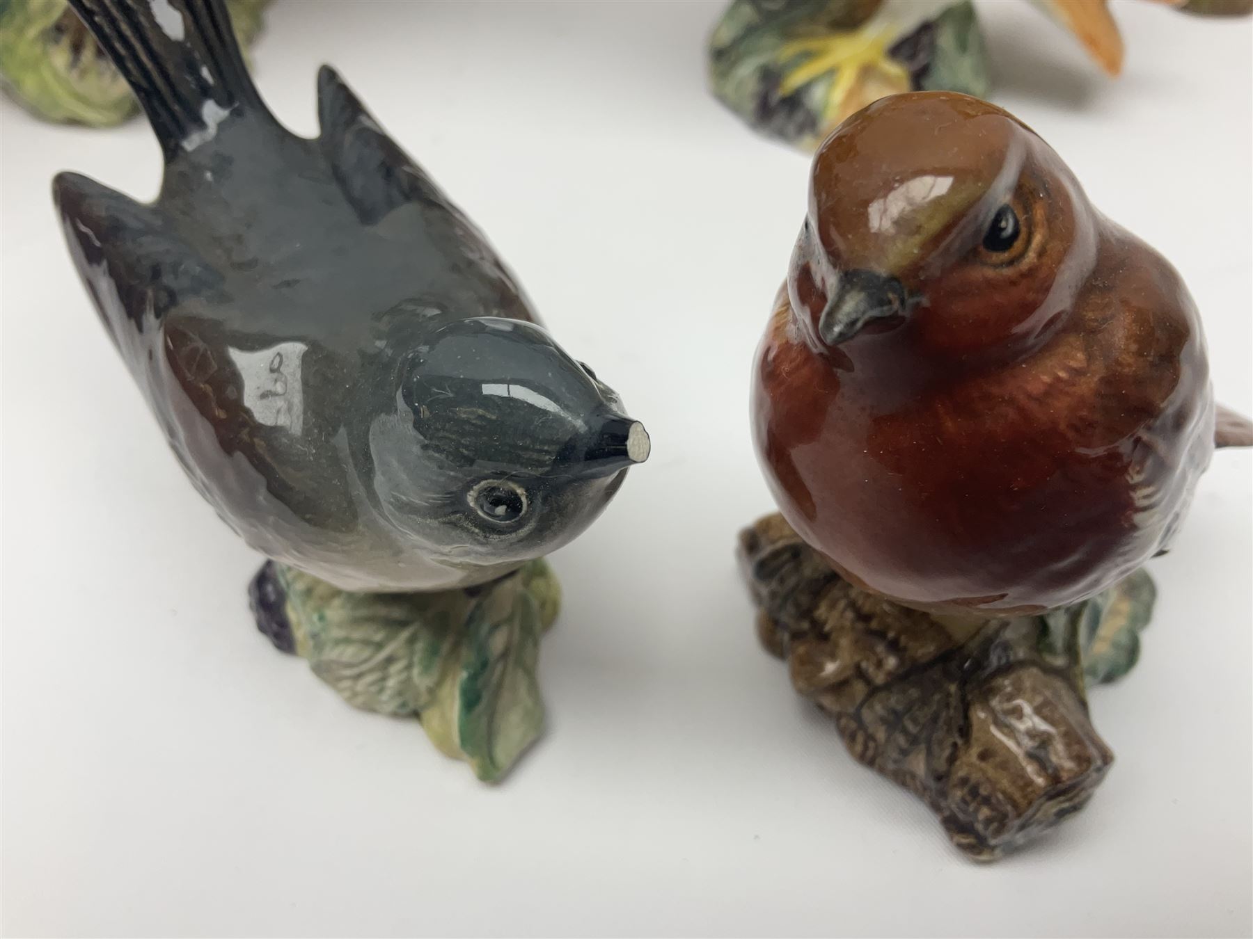 Collection twenty one of Beswick bird figures, to include Lapwing no 2416, Kingfisher no 2671, Red Pigeon 1383, Cuckoo no 2315, Nuthatch no 2418 etc