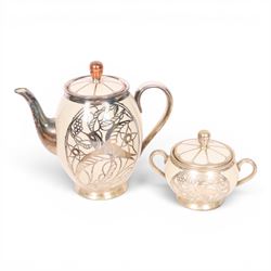 Jacob Hertel Bavarian tea service, decorated with silvered overlay of birds in foliage, comprising teapot, milk jug, covered sucrier three cups and saucers 