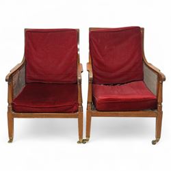 Pair of early 20th-century mahogany Bergère armchairs in the manner of Gillows, the back a...