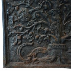 Early 20th century cast iron fireback, arched rectangular form cast in relief with a fruiting oak tree issuing acorns and leaves, surmounted by a crown, the trunk encircled by a ribbon tied cartouche with trailing scrollwork and foliate decoration, within a plain raised border