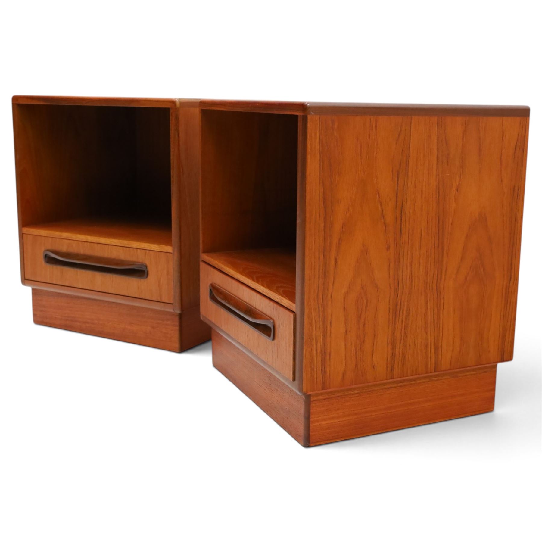 G-Plan - ‘Fresco’ teak pair of bedside cabinets, each with rectangular top over open recess and single drawer with sculpted handle, on plinth base