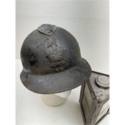 French M26 Genie (engineers) steel helmet with attached comb and helmet plate, together with WWI trench lamp