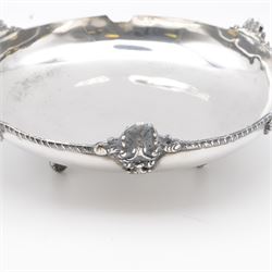 Egyptian silver bowl, of circular form, with oblique gadrooned rim and cast palmette decoration, upon three scroll feet, marked for 900 fineness, D20cm