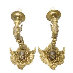 Pair of rococo style continental gilt bronze figural wall lights, modelled with winged put...