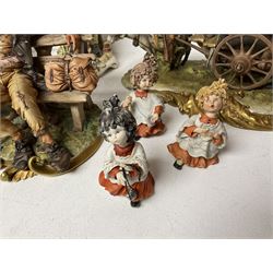 Group of Capodimonte figures, to include musical organ grinder with donkey and monkey, two tramp figures on benches, man with gun and choir boy and girl figures