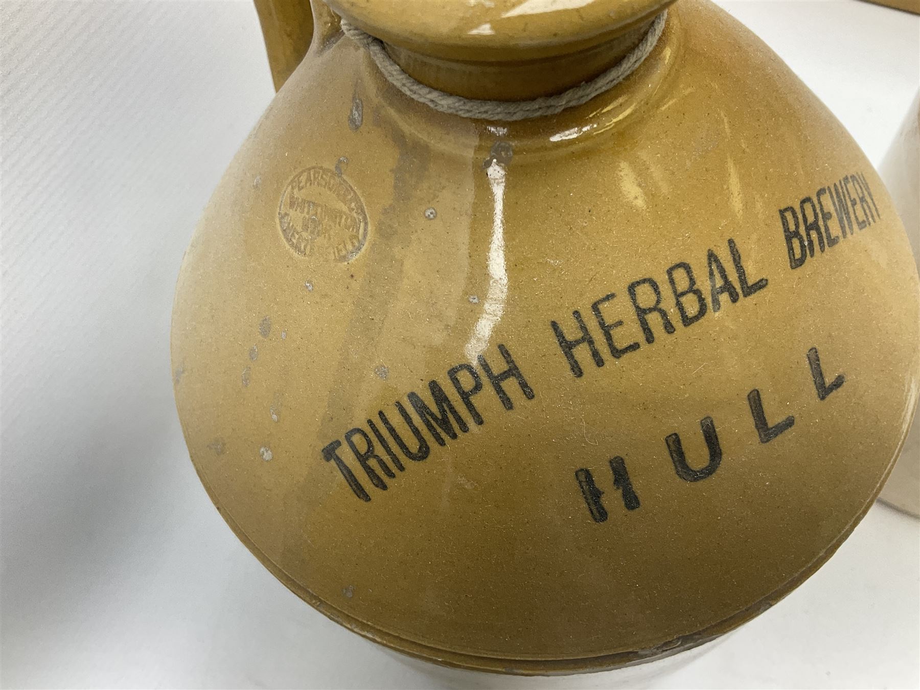 Four Hull stoneware flagons - Moors & Robsons Breweries Ltd H25cm, Hawkshaw Ltd Spencer Street Hull 1923, Triumph Herbal Brewery with brass dispensing tap and Texol Hull with screw stopper (4)  