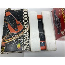 PMS Lightning 1:8 scale remote control racing car; Soma Sonic Man battery operated electronic sounds and light action figure; and CGL Galaxy Invader 10000 computer space battle game; all boxed (3)