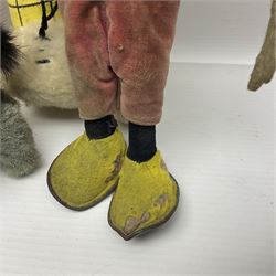Deans Rag Book Mickey Mouse soft toy, circa 1930's, black velveteen head and body, with cream face and hands, red shorts and yellow felt shoes with leather soles, marked Reg. No. 750811 to neck H20cm; mid-20th century woodwool filled plush covered teddy bear with revolving head, applied eyes, vertically stitched nose and mouth and jointed limbs H52cm; soft toy figure of Rupert Bear; and Japanese clockwork tin-plate and plush covered mechanical toy of a gnome riding a donkey (4)