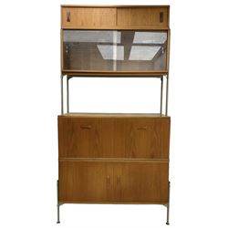 Remploy - mid-20th century teak sectional wall display unit or room divider, raised display cabinet section with sliding glass doors, central fall front section, lower double cupboard section and an additional sliding door section 