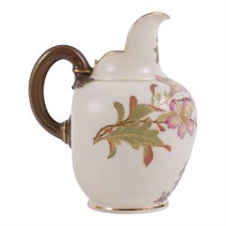 Five Royal Worcester Blush Ivory jugs, comprising one shape 1085 example with bamboo handle, one shape 1376 example with floral decoration and gilt handle and three shape 1094 examples, each decorated with floral sprigs, with printed marks beneath, tallest H14cm
