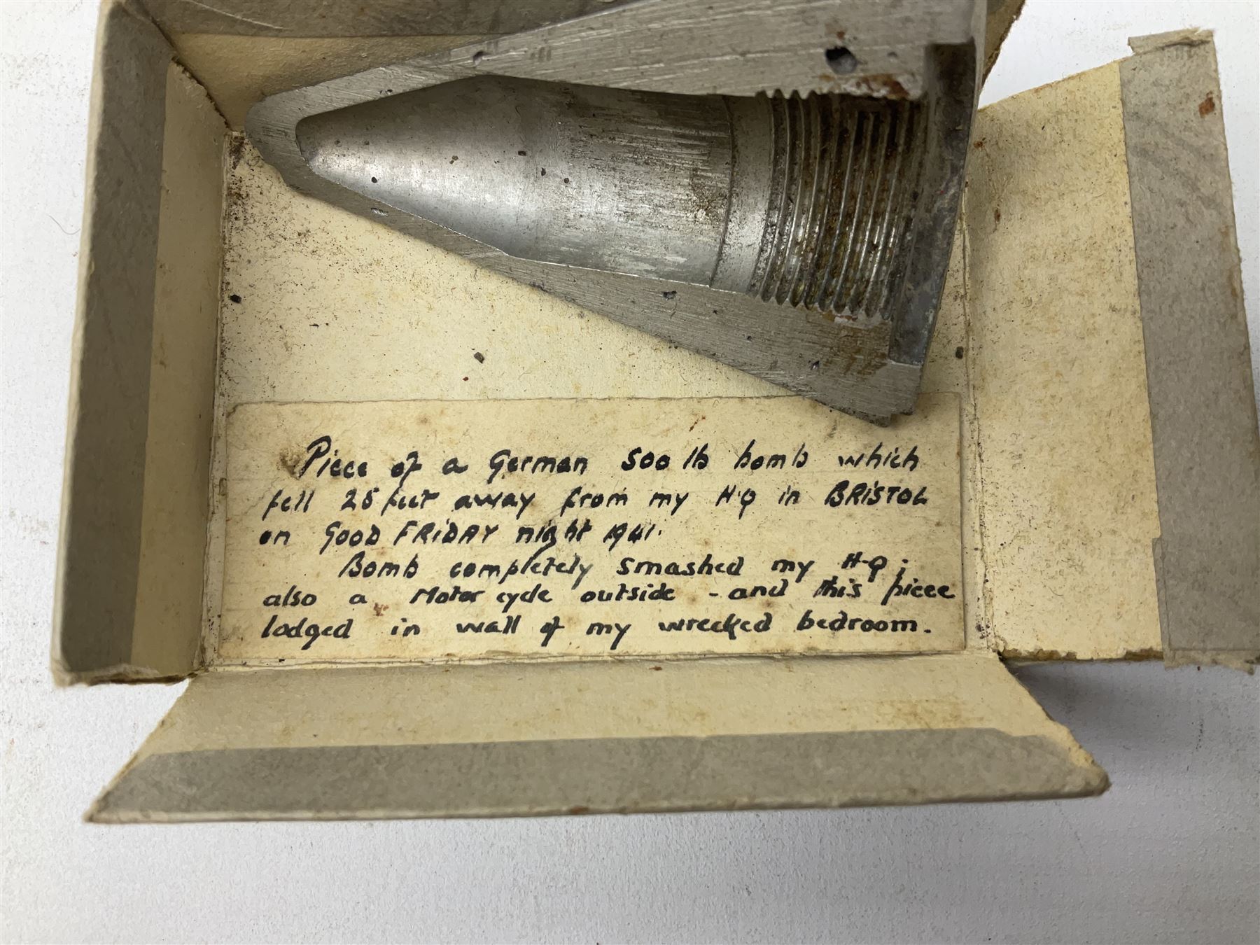 Small collection of WW2 shrapnel and German and British shell parts, most with manuscript details of where and when found including London, Leeds, Bristol, Linton-on-Ouse etc