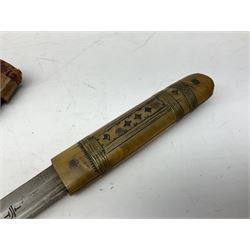 Near pair of African Moroccan Berber tribal Shula daggers each with engraved 39cm curving fullered steel blade, carved and inlaid horn grip and leather covered scabbard L57cm overall; kindjal style dagger with brass covered and jewelled grip and scabbard; another Eastern dagger with leather covered grip and scabbard; and a large Eastern knife with animal hide scabbard (5)