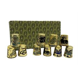 Ten cloisonné thimbles, decorated with, dragons, snakes, rams and other animals 