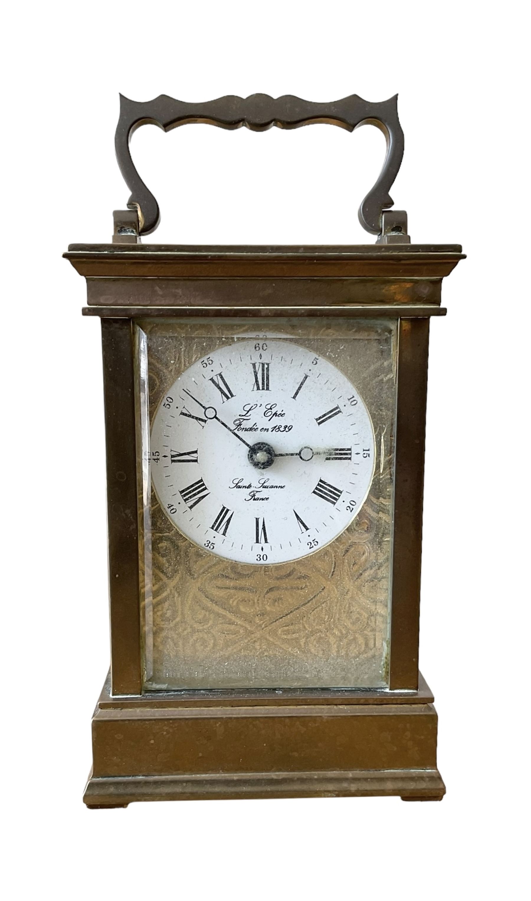French -  brass cased 20th century  8-day timepiece carriage clock, dial inscribed L' Epee Fondee-En 1839, Sainte Suxanne, France, with a circular enamel dial and an embossed brass dial mask, Roman numerals, minute markers, five minute Arabic's and steel moon hands, with a jewelled lever platform escapement.