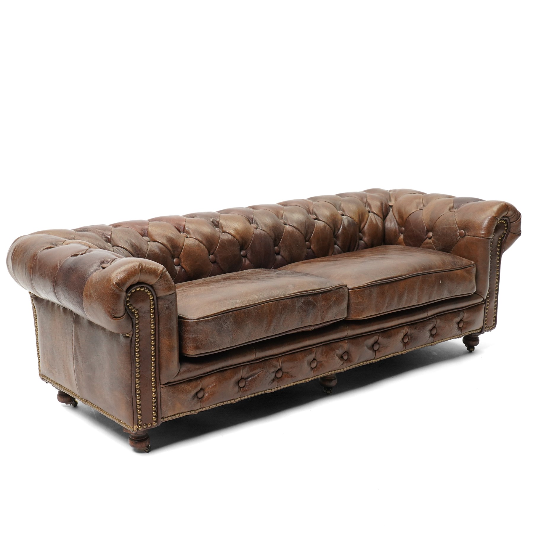 Miniature brown leather button back Chesterfield sofa, with castors 