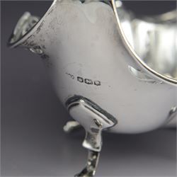 1920s silver basket, of navette form with pierced rim and lobed bowl, with fined pierced handle and upon four paw feet, hallmarked Sibray, Hall & Co Ltd, Sheffield 1923, including handle H18.5cm