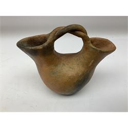 Native American Indian clay wedding vase of double necked bulbous form and a pair of candle holders, all with fire cloud effect, and signed 'Juanita' beneath, vase H13.5cm 
