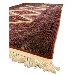 Persian rug, the interconnecting field decorated with four lozenge medallions, multiple band border with overall geometric design decorated with stylised flower head motifs