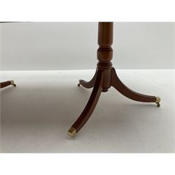 Yew wood twin pedestal extending dining table, shaped supports and brass castors (W216cm, D100cm, H77cm) and six (4+2) chairs, shaped back and upholstered in patterned fabric raised on fluted supports (W52cm)