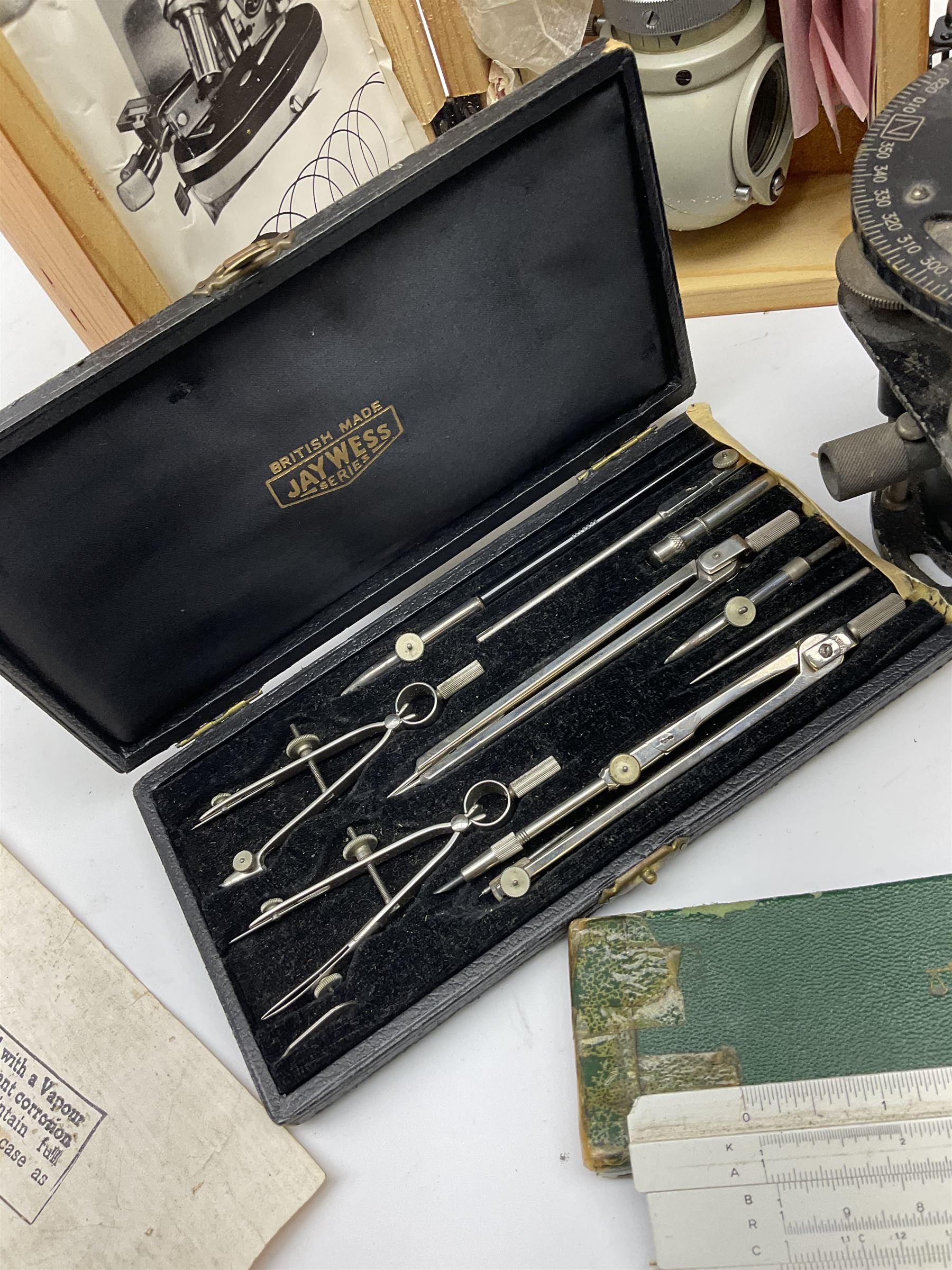 WW2 American Fairchild F-71 binocular magnifying telescope, in green painted wooden carrying box with instruction leaflet L48cm; WW2 Air Ministry Astro Compass Mk.II Ref. 6A/1174(0); Zenith Projection & Camera Lucida Attachment RA-6, boxed with instructions and 1977 purchase invoice; two cased sets of drawing instruments; and a boxed Faber slide rule (6)