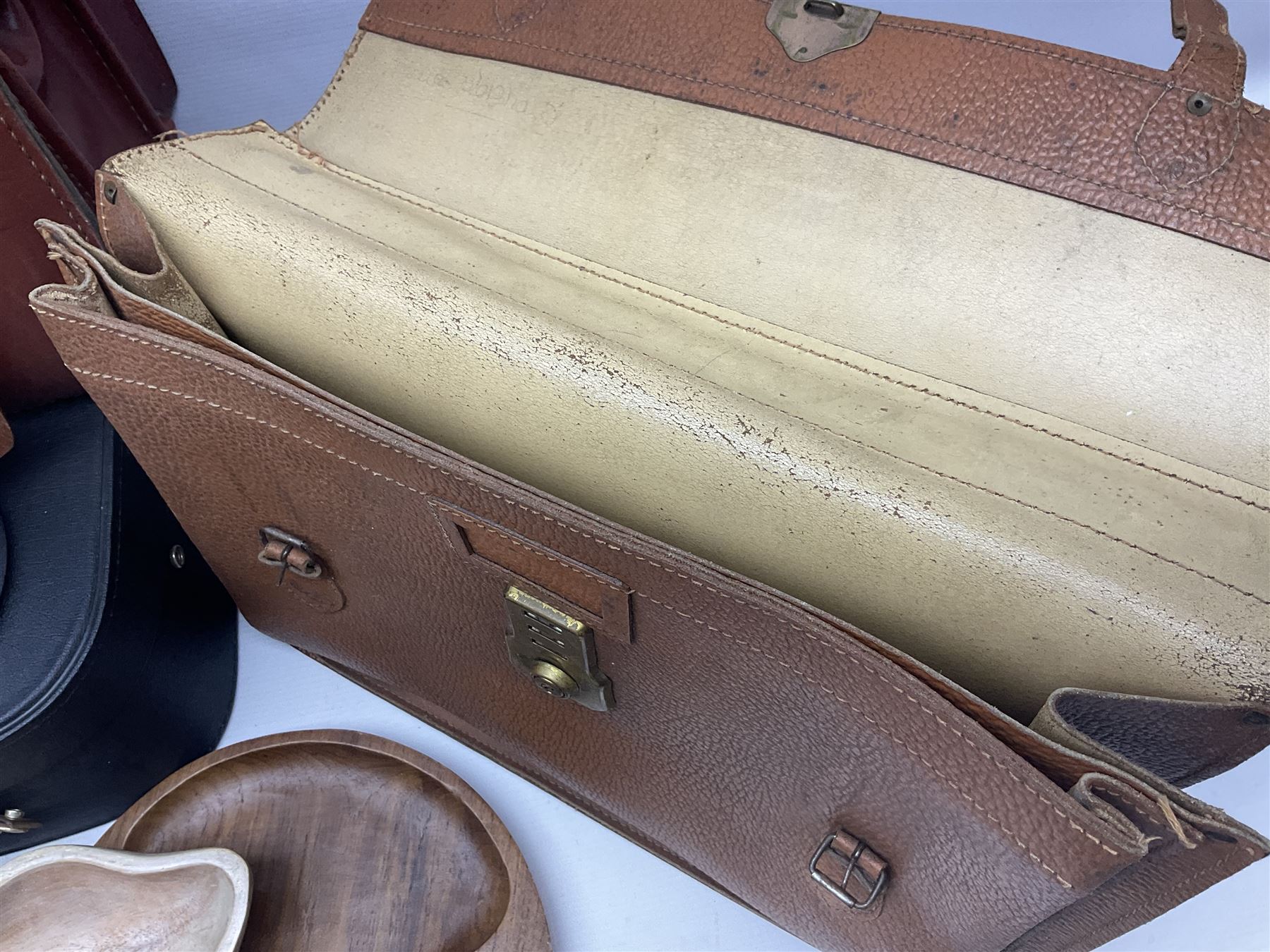 Brass oil lamp, with etched floral glass shade, leather Gladstone style doctors bag, leather satchel and vintage vanity case, three graduating wooden giraffes and other wood and metal ware, lamp H54cm