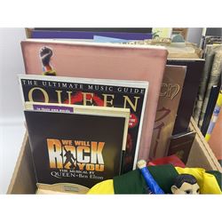 Mostly Queen and Freddie Mercury interest items, including pin badges, newspaper cuttings, diecast 'promotional' vehicles, special edition Pop Rocks figure of Freddie Mercury, VHS tapes, two charity certificates signed by Brian May and Roger Taylor, poster etc, in two boxes 