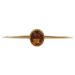 Gold oval golden citrine bar brooch, stamped 18ct