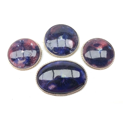  Three Moorcroft Pansy pattern circular brooches and an oval example in silver-plated mounts, two stamped L4cm max (4)  