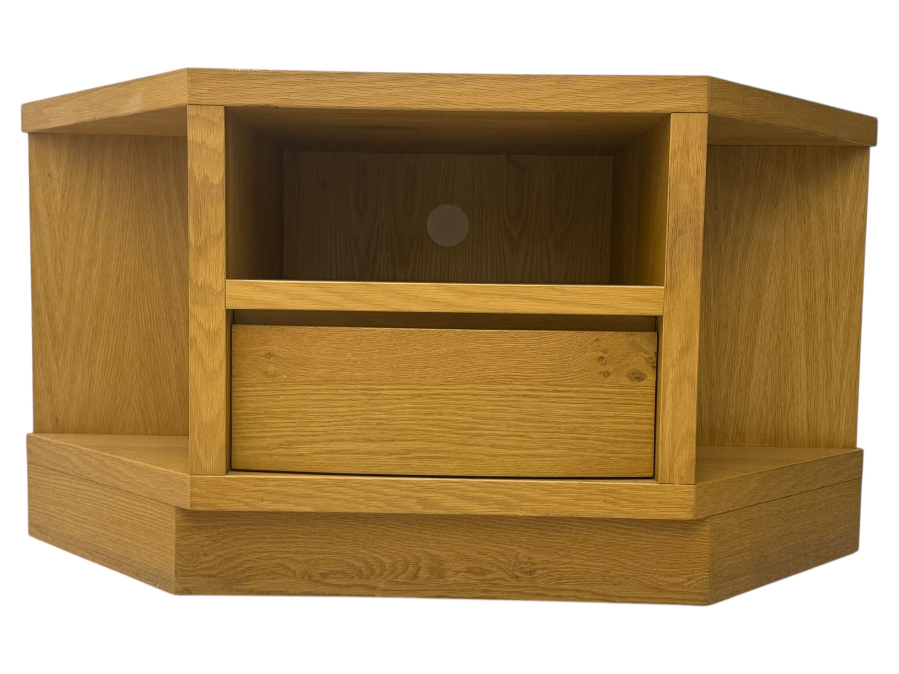 Contemporary light oak corner television stand, hexagonal top with central open section and lower drawer, shaped sides on integral plinth